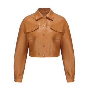 Detailed close-up of brown PU leather jacket featuring classic lapels and flap pockets