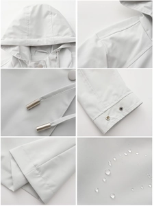 Detail view of water-resistant hooded jacket fabric with metal drawstring tips and snap cuffs