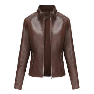 Detailed view of quilted shoulders and metal zipper on brown leather jacket