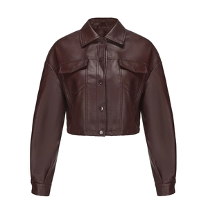 Close-up of brown faux leather jacket with classic lapel, front buttons and fine texture