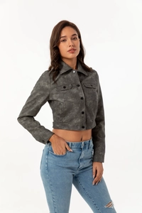 Close-up of a dark grey faux suede jacket with classic collar and cargo pockets