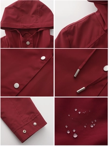 Detail showing water-repellent fabric, silver snaps, and adjustable drawstrings on a burgundy parka