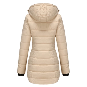 Detail of windproof black ribbed cuffs and quilted texture on a warm beige winter coat