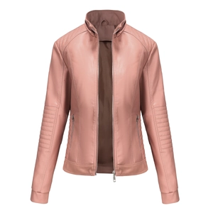 Detail of rose pink faux leather jacket featuring quilted shoulder pads and silver zippers