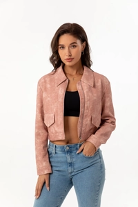 Detail view of pink faux suede jacket featuring lapel collar and metal zipper closure