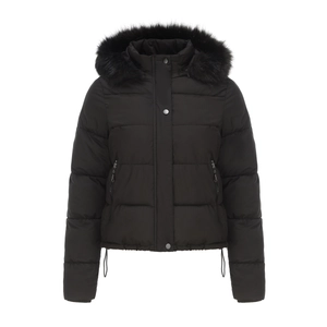 Close-up of winter jacket featuring a plush faux fur hood and warm quilted texture