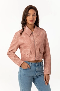 Detail of pink faux suede jacket featuring zipper closure and decorative flap pockets