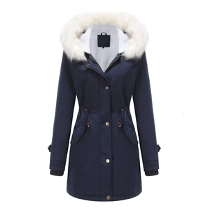 Detailed view of women's navy parka with fluffy white faux fur collar and cozy fleece lining