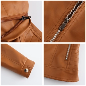 Close-up of caramel leather jacket showing silver zippers, metal buttons and neat stitching