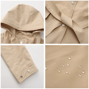 Waterproof details of khaki hooded windbreaker showing waist belt and metal buttons