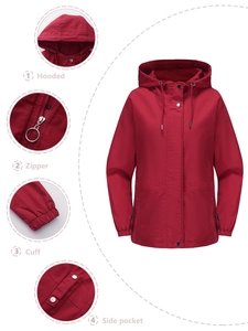 Detail view of red windbreaker showing hooded drawstrings, zipper, elastic cuffs, and side pockets