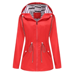 Detail of red hooded raincoat featuring striped lining and adjustable drawstring waist