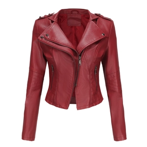 Detail of burgundy leather jacket featuring silver rivets and quilted sleeve patterns