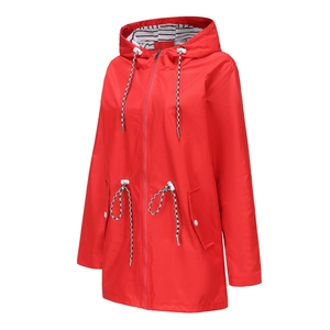 Detail of red waterproof hooded raincoat showing striped lining and adjustable drawstring