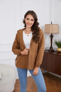 Detail of a brown hooded windbreaker jacket with zipper and snap button pockets