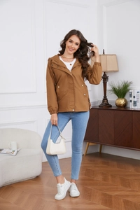Detail of a casual hooded windbreaker jacket with utility pockets and elastic cuffs
