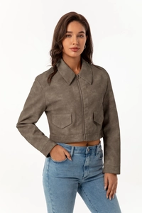 Detail of brownish gray suede jacket featuring flap pockets and smooth metal zipper