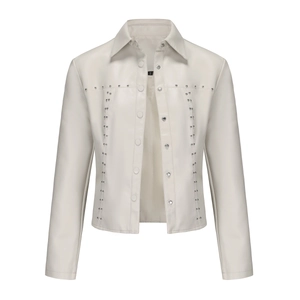 Close-up of cream faux leather jacket with silver rivets and metal buttons on lapel