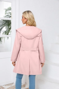 Back view of light pink hooded windbreaker jacket with waist belt and split hem detail