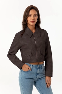 Detail of dark grey short zip jacket featuring lapel collar and matte suede texture