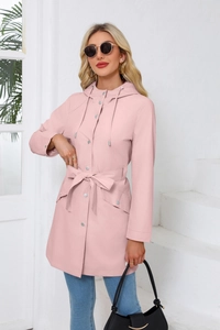 Detail of light pink hooded windbreaker featuring a waist belt and large flap pockets