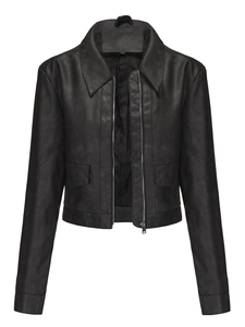 Detail view of black faux leather jacket showing zipper closure and flap pockets