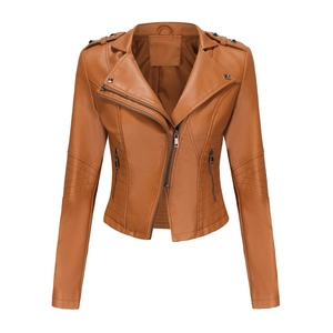 Close-up of caramel faux leather jacket with metal zippers and stud details