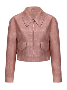 Detailed close-up of a short faux suede jacket in dusty pink with silver zipper and flap pockets