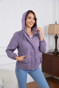 Close-up of purple hooded windbreaker featuring adjustable drawstring waist and elastic cuffs
