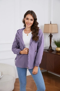 Detail of purple hooded windbreaker featuring metal zipper and snap button pockets