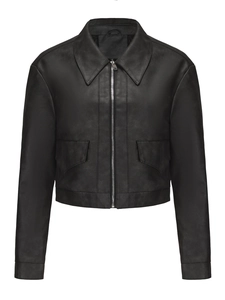 Close-up of black faux leather jacket featuring silver zipper and front flap pockets