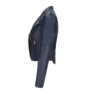Detail of navy blue faux leather jacket featuring silver studs and pleated arm sleeves