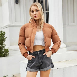 Short brown padded jacket for women featuring a high collar and casual loose puffer fit