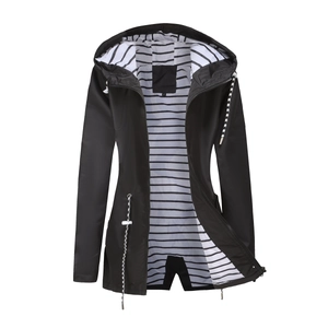 Detail view of water-resistant hooded trench coat with black and white striped lining