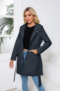 Detail view of water-resistant hooded trench coat with metal snaps and belted waist