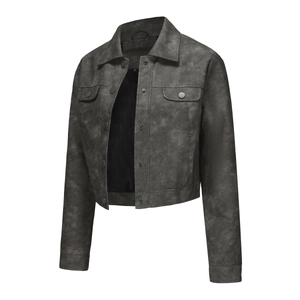 Detailed view of dark grey faux leather jacket with metal snap buttons and chest pockets