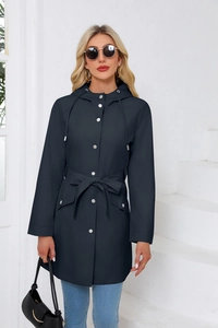 Detail of navy blue waterproof hooded jacket featuring silver snap buttons and adjustable waist belt