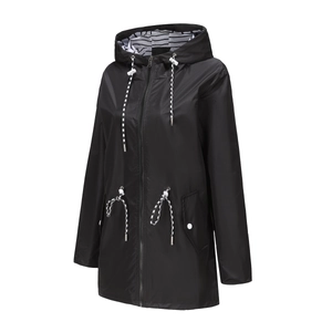 Detail of waterproof raincoat showing black-white striped hood lining and adjustable drawstrings
