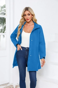 Close-up of royal blue windbreaker featuring zipper closure and metallic snap buttons