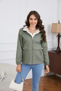 Detail of army green hooded windbreaker jacket with contrast lining and metal zipper