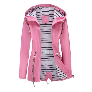 Detail of pink hooded raincoat featuring classic black and white striped lining