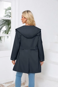 Detail view of water-resistant hooded trench coat featuring back waist belt and center slit
