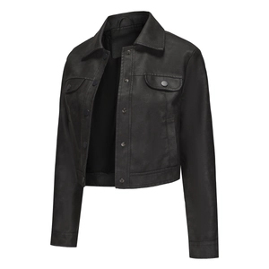 Detail of black faux leather jacket with lapel collar and flap chest pockets