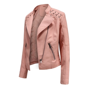 Detail of pink faux leather biker jacket featuring quilted shoulders and metal eyelets