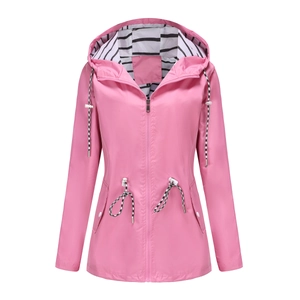 Detail of pink hooded raincoat featuring striped lining and adjustable drawstring waist