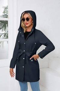 Detail of waterproof hooded trench coat with adjustable waist belt and drawstrings