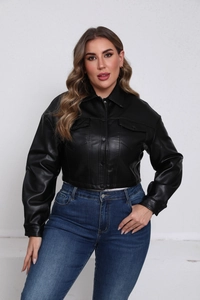 Detail of a black faux leather jacket with metal buttons and classic lapel collar
