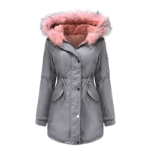 Close-up of women's parka featuring a deep grey windproof shell and pink faux fur hood lining