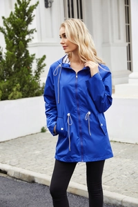 Detail of blue waterproof hooded windbreaker with striped lining and adjustable drawstring