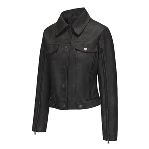 Detail of female biker jacket sleeve featuring decorative silver zippers and black faux leather